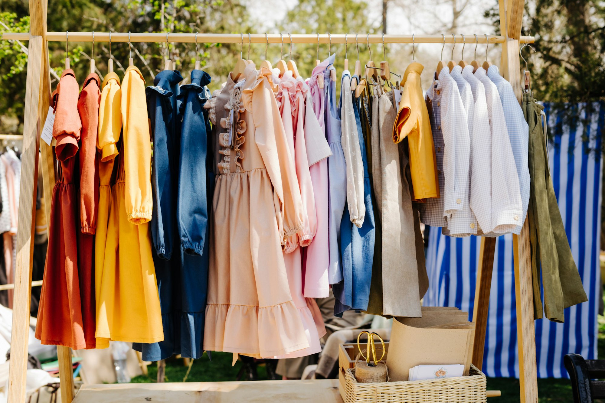 Clothes at a street garage sale. Children's clothing at a street fair.